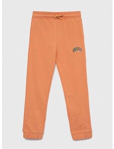 Детски памучен спортен панталон Guess в оранжево с изчистен дизайн