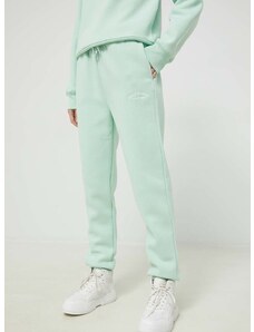 Спортен панталон Juicy Couture в зелено с апликация