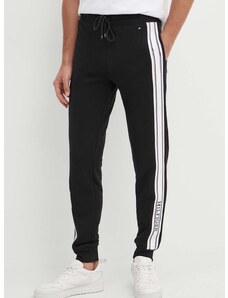 Спортен панталон Tommy Hilfiger в черно с апликация UM0UM03198