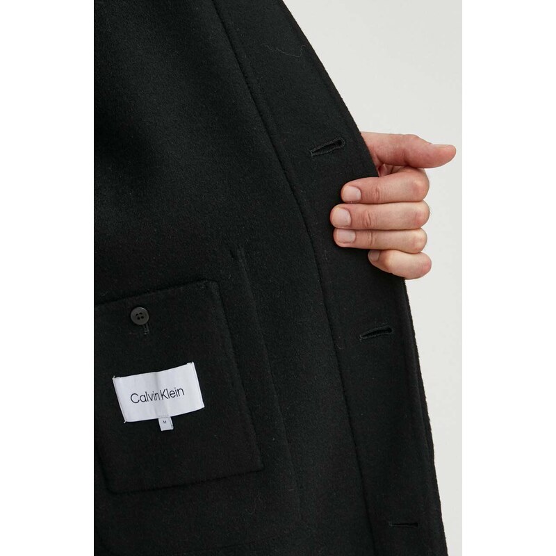 Вълнено палто Calvin Klein в черно преходен модел с уголемена кройка