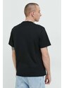 Памучна тениска GCDS в черно с апликация