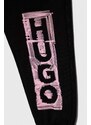 Детски памучен спортен панталон HUGO в черно с принт